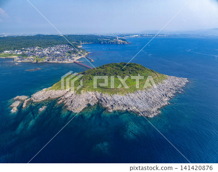 Drone aerial view of Oshima Island and the red Oshima Bridge in Mikuni-cho, Sakai City, Fukui Prefecture, overlooking the Sea of Japan. Drone aerial view of Oshima Island and the red Oshima Bridge in Mikuni-cho, Sakai City, Fukui Prefecture, overlooking the Sea of Japan. 141420876