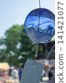 A wind chime that shines in the summer blue sky 141421077