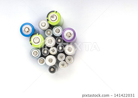 Top View of a Large Collection of Assorted Used AA, AAA, and C Size Batteries with Colorful Caps on a Clean White Background Ready for Recycling Top View of a Large Collection of Assorted Used AA, AAA, and C Size Batteries with Colorful Caps on a Clean White Background Ready for Recycling 141422031