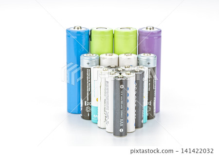 Assorted Collection of Colorful AA and AAA Rechargeable and Alkaline Batteries in Blue Green Purple and Gray Arranged in Group on Clean White Background Assorted Collection of Colorful AA and AAA Rechargeable and Alkaline Batteries in Blue Green Purple and Gray Arranged in Group on Clean White Background 141422032