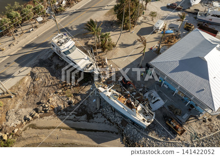 Capsized yachts left forsaken on shore after hurricane Milton on Manasota Key in Englewood, Florida Capsized yachts left forsaken on shore after hurricane Milton on Manasota Key in Englewood, Florida 141422052