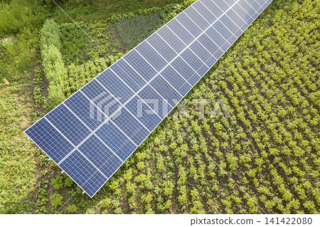 Blue solar panels for clean energy on green grass. Blue solar panels for clean energy on green grass. 141422080