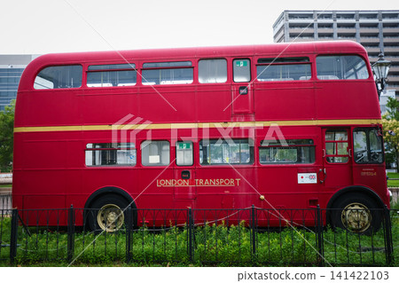 A classic red double-decker London bus on display. A classic red double-decker London bus on display. 141422103