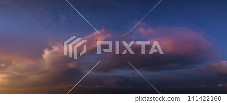 Amazing sunset skyscape. Evening sky with bright colorful orange and yellow clouds Amazing sunset skyscape. Evening sky with bright colorful orange and yellow clouds 141422160