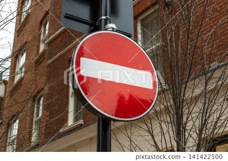 Red no entry traffic sign on an urban street Red no entry traffic sign on an urban street 141422500
