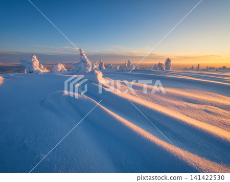 Magical evening landscape of a winter nature at sunset with a glowing sky. Magical evening landscape of a winter nature at sunset with a glowing sky. 141422530