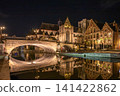 Night view of Ghent, Belgium: the illuminated St. Michael's Bridge and the reflection of historical buildings. 141422862