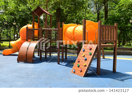 Climbing structures and slides are playground equipment for children, which are part of the public park in Bangkok capital city , Thailand. Climbing structures and slides are playground equipment for children, which are part of the public park in Bangkok capital city , Thailand. 141423127