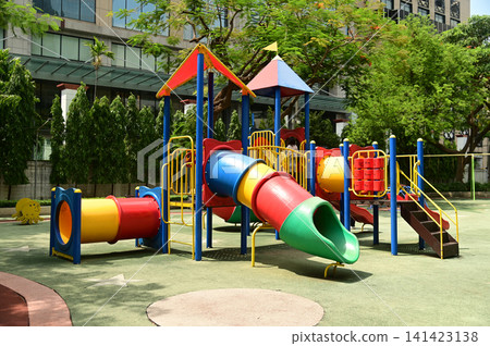 Climbing structures and slides are playground equipment for children, which are part of the public park in Bangkok capital city , Thailand. Climbing structures and slides are playground equipment for children, which are part of the public park in Bangkok capital city , Thailand. 141423138