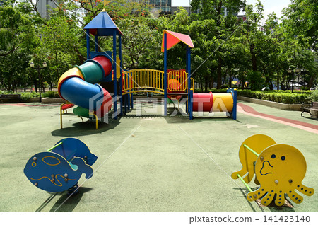 Climbing structures and slides are playground equipment for children, which are part of the public park in Bangkok capital city , Thailand. Climbing structures and slides are playground equipment for children, which are part of the public park in Bangkok capital city , Thailand. 141423140