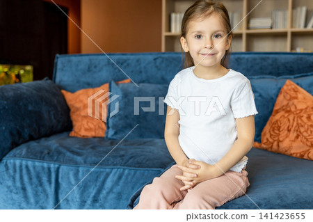 Pretty caucasian big-eyed little girl looking looking into camera Pretty caucasian big-eyed little girl looking looking into camera 141423655