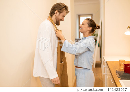 Cute young couple in the kitchen feeling excited and happy 141423937
