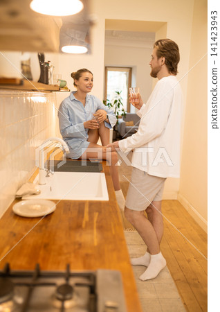 Cute young couple in the kitchen feeling excited and happy Cute young couple in the kitchen feeling excited and happy 141423943