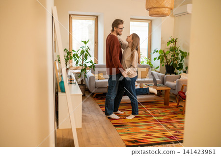 Young couple dancing in an old-fashioned room and feeling contented and happy 141423961