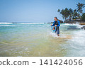 Caucasian father and son enjoying a tropical beach day in Sri Lanka 141424056