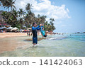 Caucasian Father and Son Enjoying a Tropical Beach Day in Sri Lanka 141424063