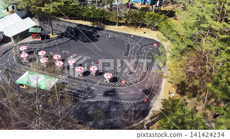 Aerial view of an amusement park's go-kart track Aerial view of an amusement park's go-kart track 141424234