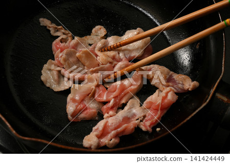 Pork being fried Pork being fried 141424449