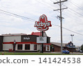 Arby's Fast Food Restaurant with blue sky and clouds 141424538