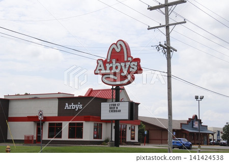 Arby's Fast Food Restaurant with blue sky and clouds 141424538