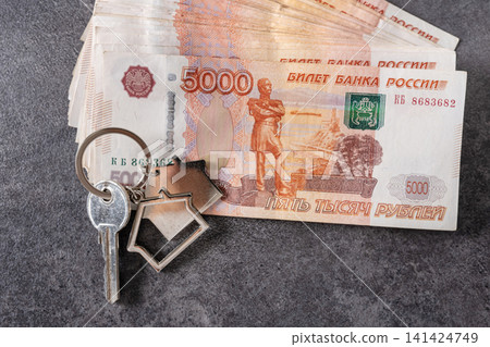 House keys with Russian ruble banknotes for home purchase concept House keys with Russian ruble banknotes for home purchase concept 141424749