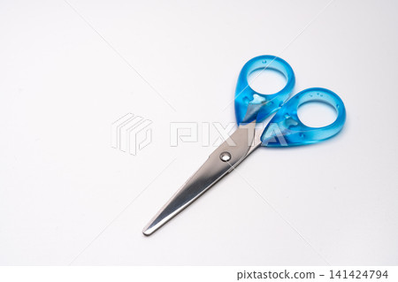 A simple composition with scissors placed against a white background and ample white space. A simple composition with scissors placed against a white background and ample white space. 141424794