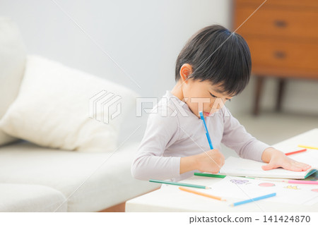 A boy drawing A boy drawing 141424870