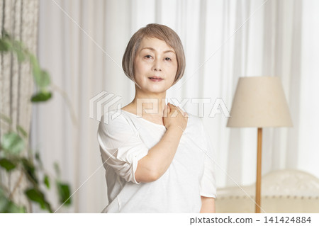 Portrait of a senior woman, natural light Portrait of a senior woman, natural light 141424884