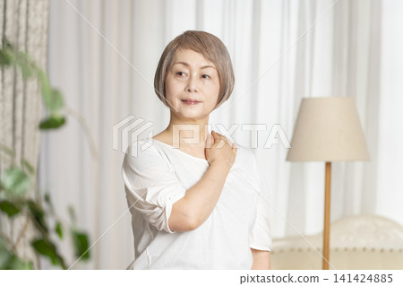 Portrait of a senior woman, natural light Portrait of a senior woman, natural light 141424885