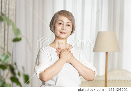 Portrait of a senior woman, natural light Portrait of a senior woman, natural light 141424901