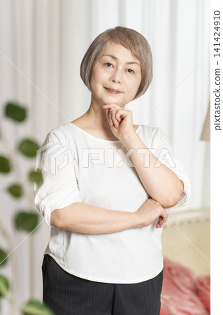 Portrait of a senior woman, natural light Portrait of a senior woman, natural light 141424910