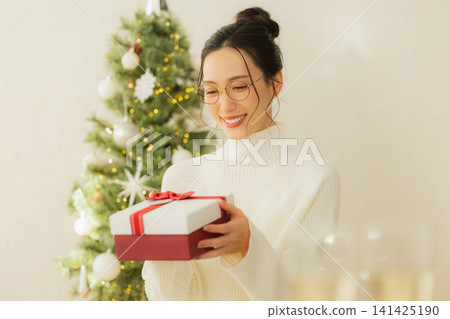 A woman with a present A woman with a present 141425190