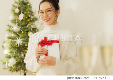 A woman with a present A woman with a present 141425198