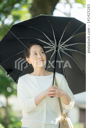 Senior woman sunblind 141425263