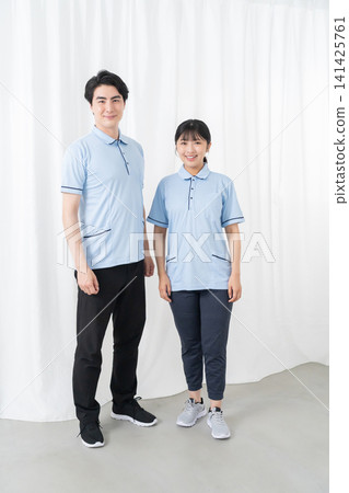 Smiling male and female care staff Smiling male and female care staff 141425761