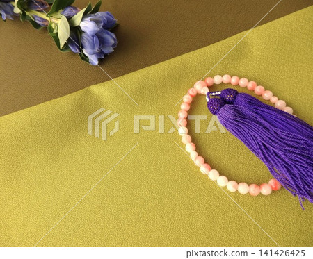Prayer beads and gentian flowers: background to Buddhist ceremonies Prayer beads and gentian flowers: background to Buddhist ceremonies 141426425