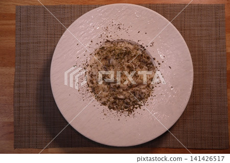 Creamy Pasta Dish with Herbs on White Plate 141426517
