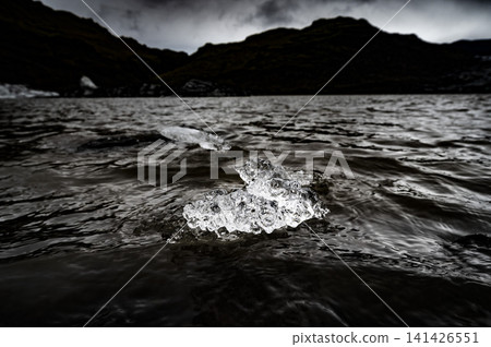 Crystal-clear ice floes floating on a glacial lake (Iceland's Diamond Ice) Crystal-clear ice floes floating on a glacial lake (Iceland's Diamond Ice) 141426551