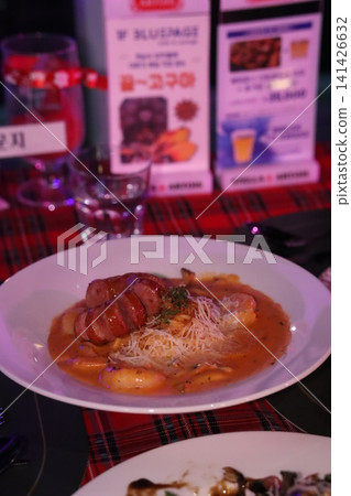 Sausage and Cheese Dish on White Plate 141426632