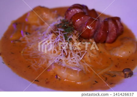 Garnished Pasta Dish with Shrimp and Meat Slices 141426637