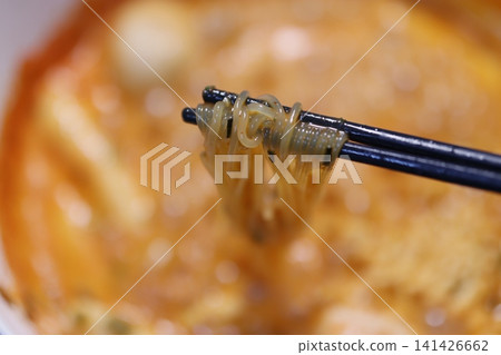 Chopsticks Lifting Noodles from Bowl Chopsticks Lifting Noodles from Bowl 141426662
