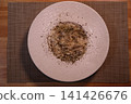 Creamy Pasta Dish with Herbs on White Plate 141426676