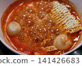 Spicy Ramen Bowl with Bubbling Broth and Noodles 141426683