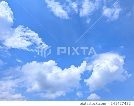 A scene of cumulonimbus clouds and blue sky adorning the summer sky. A scene of cumulonimbus clouds and blue sky adorning the summer sky. 141427422