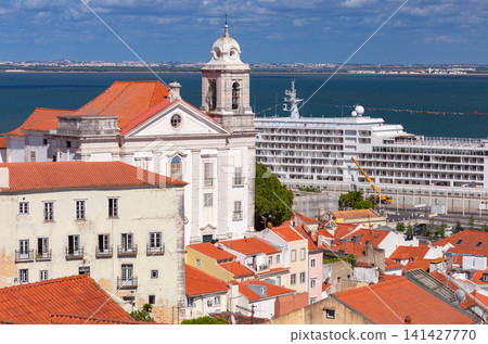 Historic church and cruise ship on the Tagus River in Lisbon, Portugal Historic church and cruise ship on the Tagus River in Lisbon, Portugal 141427770