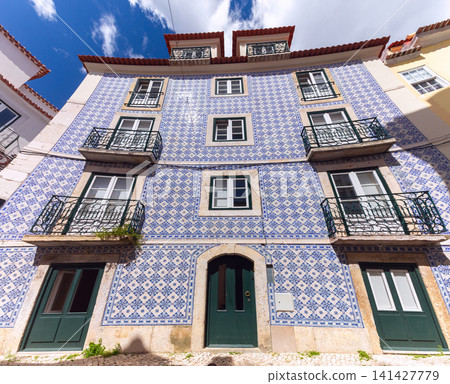 Traditional azulejo tiled residential building facade in Lisbon, Portugal Traditional azulejo tiled residential building facade in Lisbon, Portugal 141427779