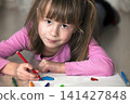 Child girl drawing with colorful pencils crayons heart on white paper. Art education, creativity concept. 141427848