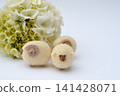 Cream-colored hydrangeas and felt sheep 141428071