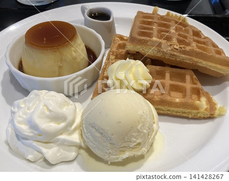 Vanilla ice cream, waffles, pudding, whipped cream Vanilla ice cream, waffles, pudding, whipped cream 141428267