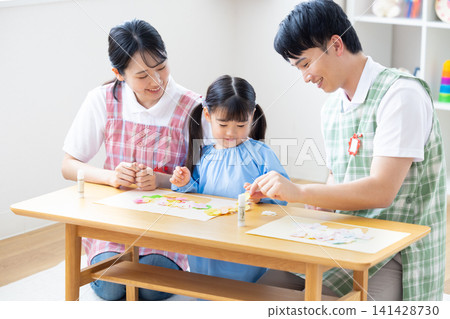 Childcare image: A girl and a childcare worker who work Childcare image: A girl and a childcare worker who work 141428730